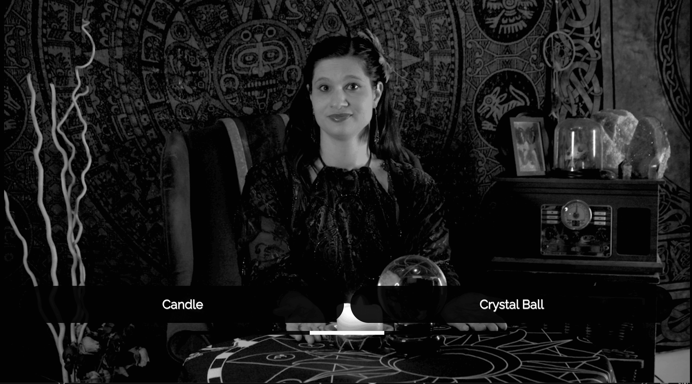 nteractive Seance - Live Action project from Austin Community College Students - black and white scene showing a woman sitting at a table with a crystal ball on the top. The choices read "candle" or "crystal ball".
