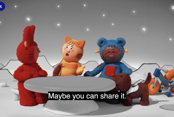 A still from Mixmups with Ultra Access. An accessible tv show. The still features simplified visuals with the three characters in colour and the background in black and white.