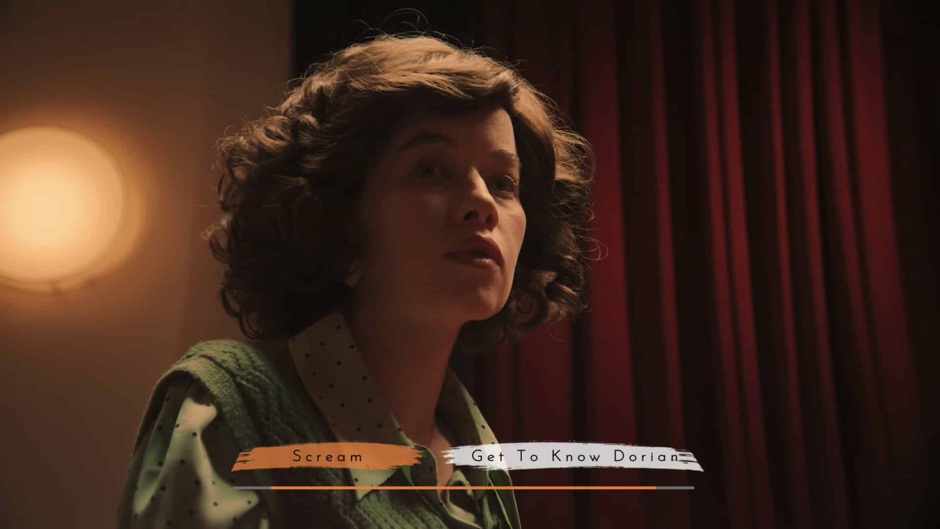Still from interactive feature film The Gallery. A young woman looks on, with a red curtain and spotlight behind her